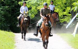 Lee completes her first two day 50 mile ride at GMHA, with her friends Roxie (middle, ridden by Denny Emerson) and Camille (ridden by Robin Malkasian).